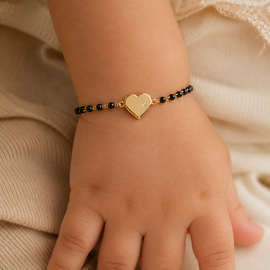 Baby wrist wearing heart nazariya — 14k gold kids nazariya bracelet with diamond heart charm