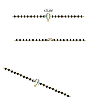 Side angle of hot air balloon bracelet — 14k gold kids nazariya with turquoise charm