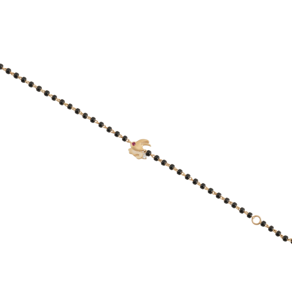 Bunny charm bracelet on white background — 14k gold kids nazariya diamond bracelet with black beads