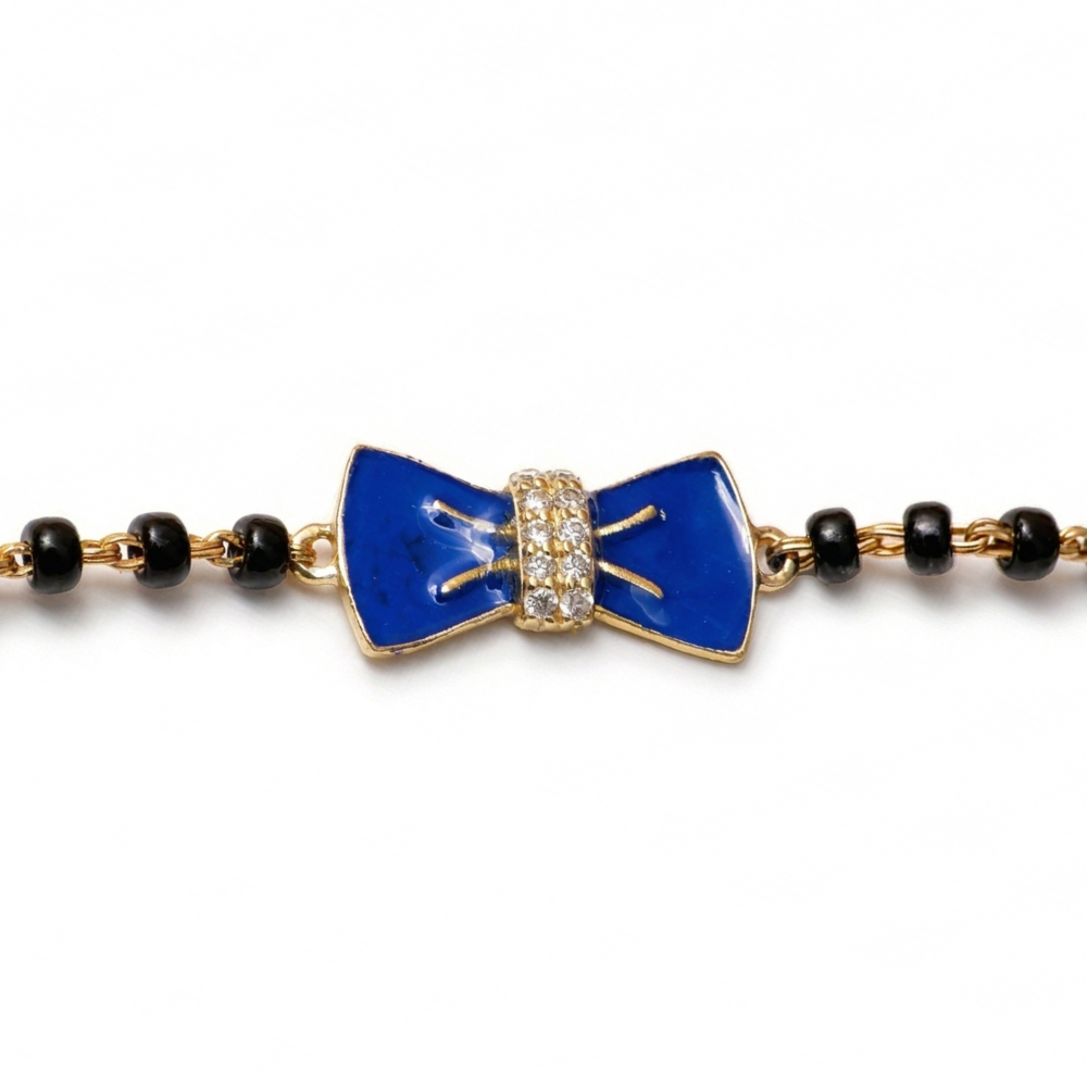 Natural diamond bow detail — 14k gold kids nazariya bracelet close-up
