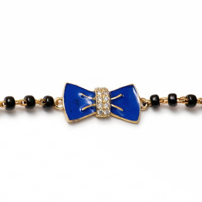 Natural diamond bow detail — 14k gold kids nazariya bracelet close-up