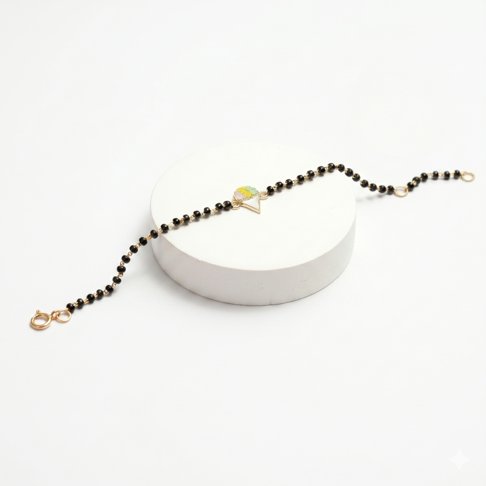 Hero shot on white stand — 14k gold ice cream kids nazariya with black beads