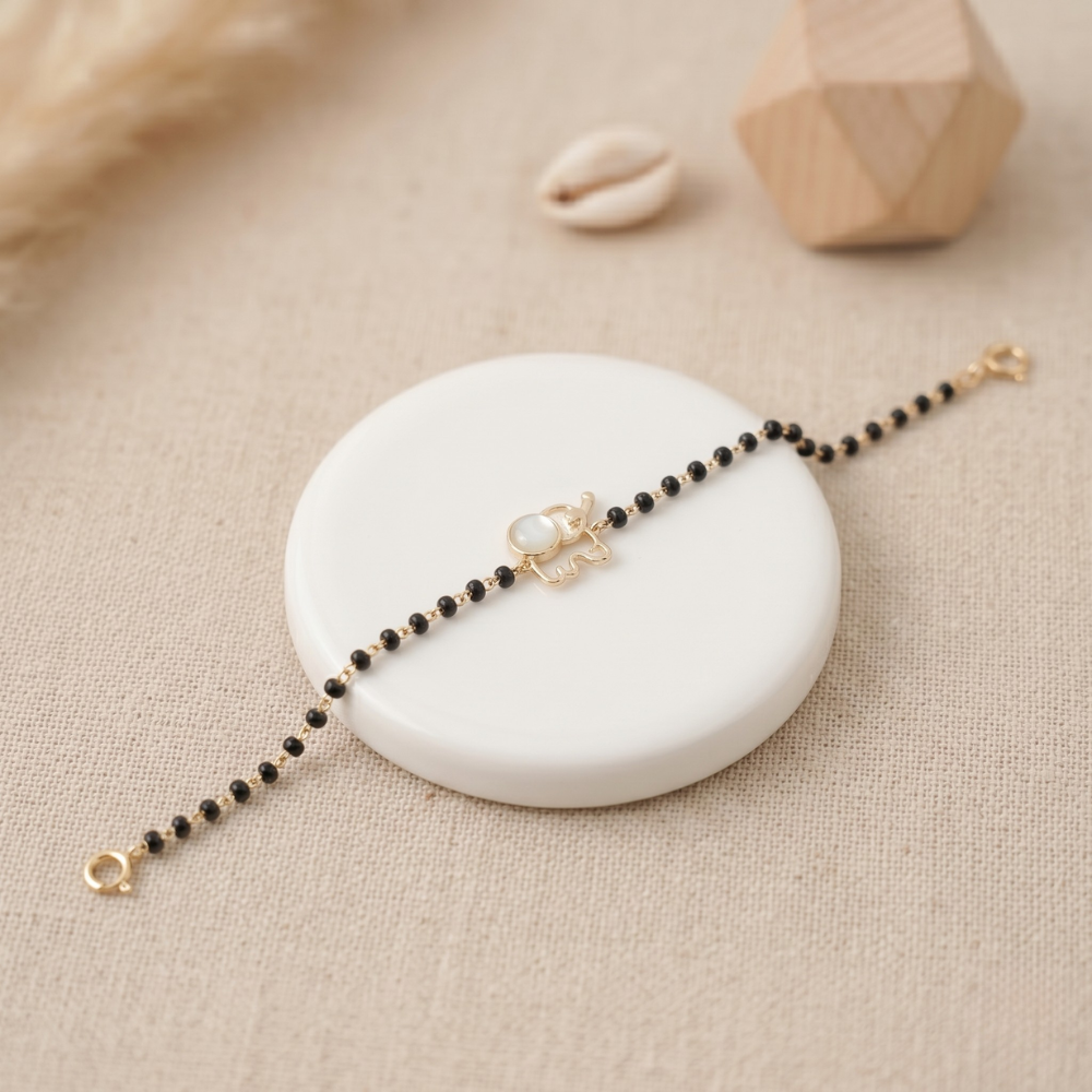 Mother of pearl turtle kids nazariya — 14k gold diamond bracelet with black beads