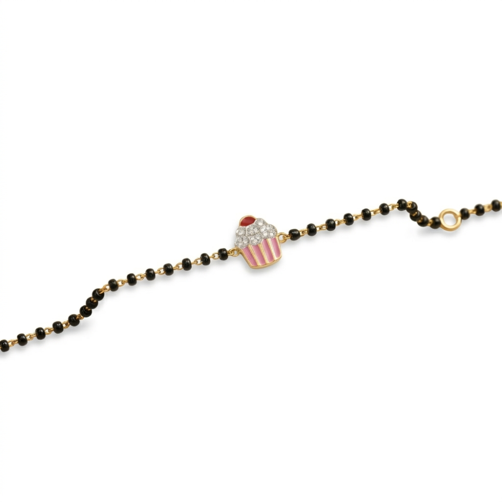 Cupcake charm bracelet on white background — 14k gold kids nazariya with natural diamonds