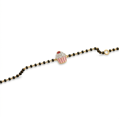 Cupcake charm bracelet on white background — 14k gold kids nazariya with natural diamonds