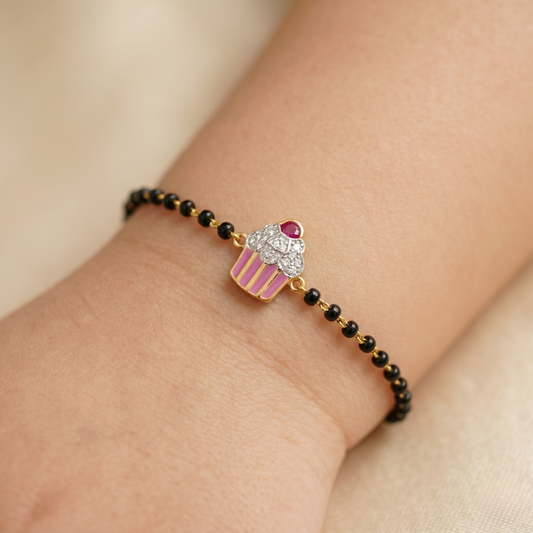 Child wearing cupcake nazariya — 14k gold kids nazariya with black beads and diamonds