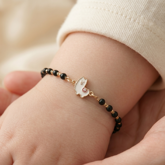 Worn on child’s wrist — 14k gold llama kids nazariya diamond bracelet with black beads
