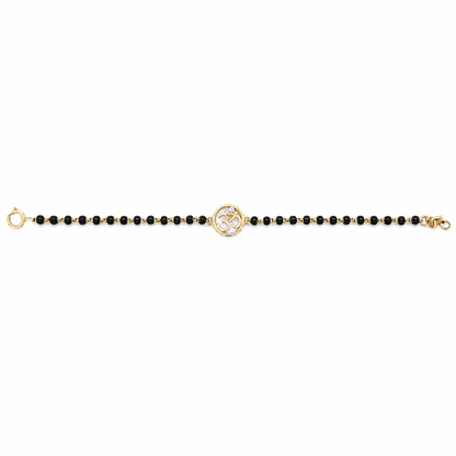 Front view on white background — 14k gold kids nazariya with Om charm and black beads
