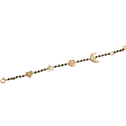 Moon star heart charms detail — 14k gold kids nazariya with protective celestial symbols