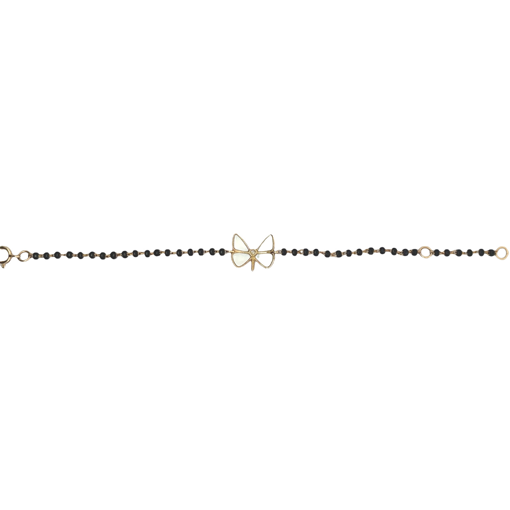 front hero shot of dragonfly charm on black beads — 14k gold kids nazariya with natural diamond detail