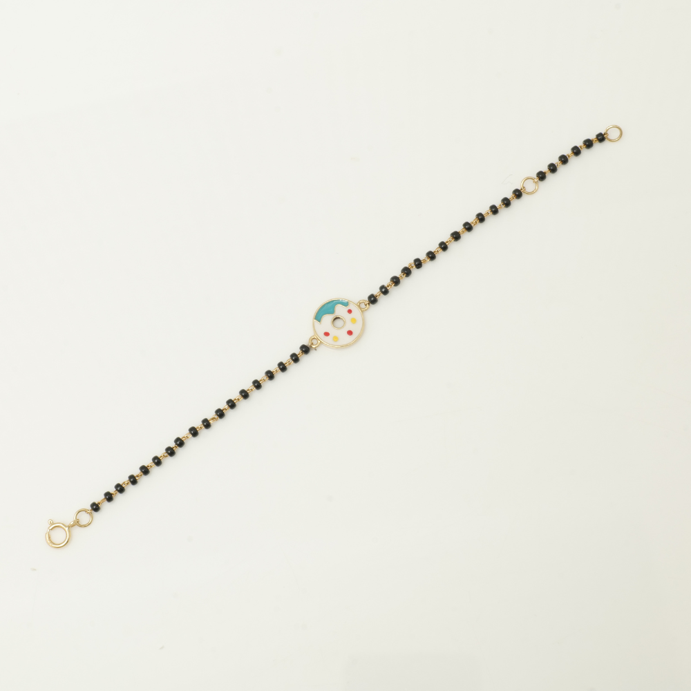 gift box view of donut kids nazariya — 14k gold diamond bracelet for baby with black beads