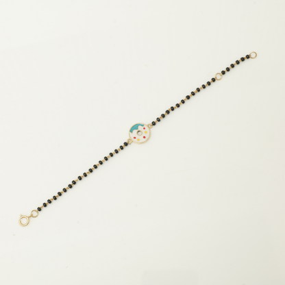 gift box view of donut kids nazariya — 14k gold diamond bracelet for baby with black beads