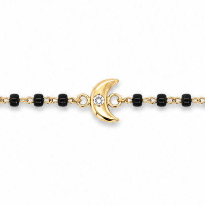 Close-up of round diamond on moon charm — 14k gold kids nazariya with natural diamond