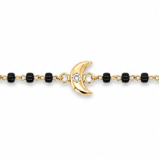 Close-up of round diamond on moon charm — 14k gold kids nazariya with natural diamond