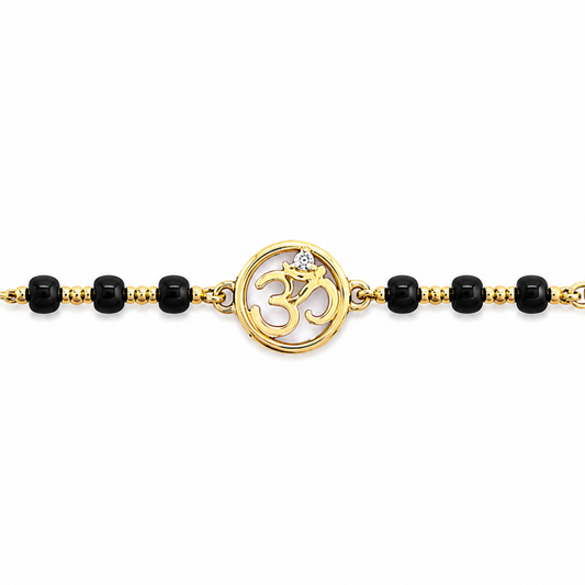 Close-up of diamond detail — 14k gold kids nazariya with natural diamond on Om charm