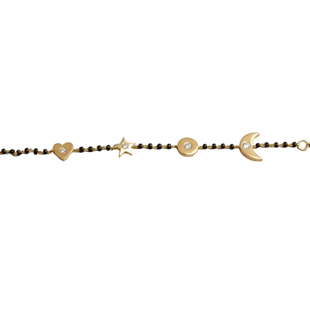 Natural diamond charms close-up — 14k gold kids nazariya with heart moon and star details