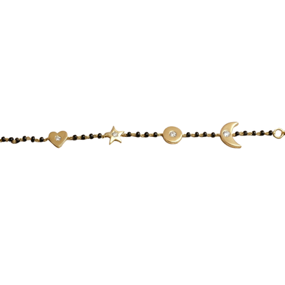 Natural diamond charms close-up — 14k gold kids nazariya with heart moon and star details