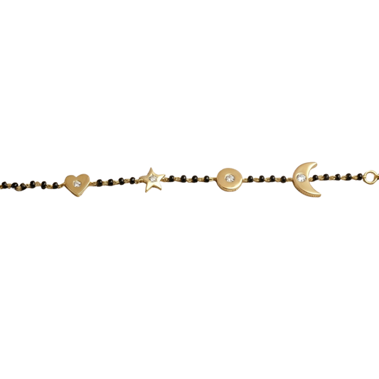 Natural diamond charms close-up — 14k gold kids nazariya with heart moon and star details