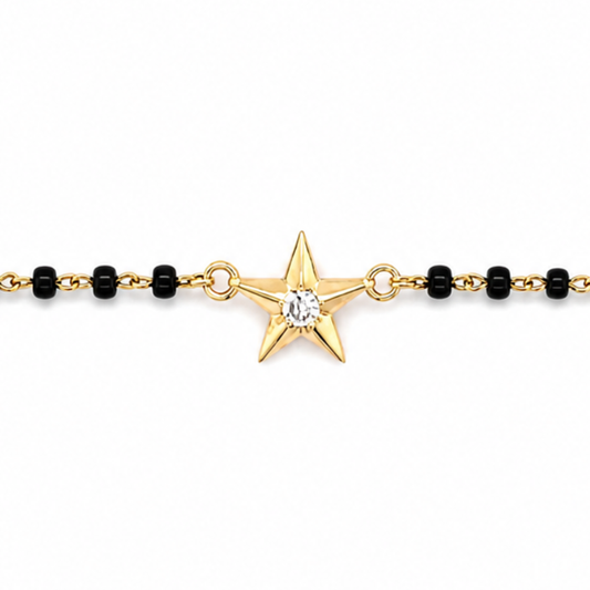 close-up of star charm — 14k gold kids nazariya with protective star symbol