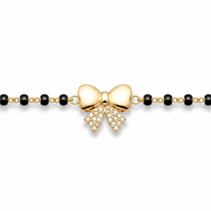 Close-up of pavé diamonds — 14k gold bow kids nazariya with natural diamond bow tails