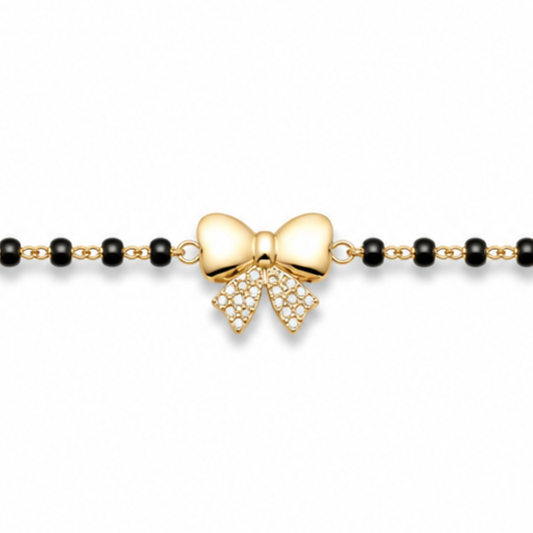 Close-up of pavé diamonds — 14k gold bow kids nazariya with natural diamond bow tails