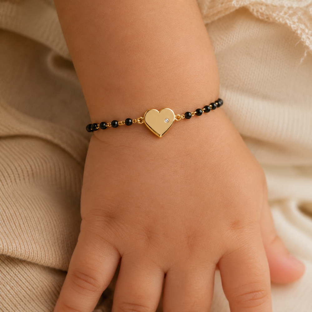 Baby wrist wearing heart nazariya — 14k gold kids nazariya bracelet with diamond heart charm