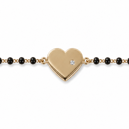 Heart charm and black bead detail — 14k gold heart kids nazariya with protective symbol
