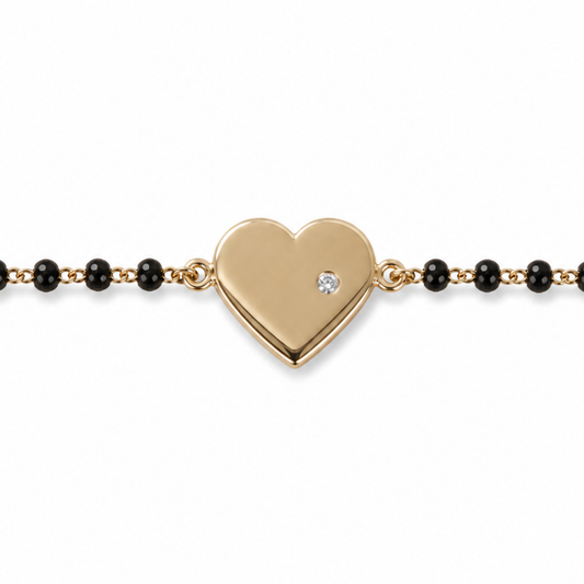 Heart charm and black bead detail — 14k gold heart kids nazariya with protective symbol